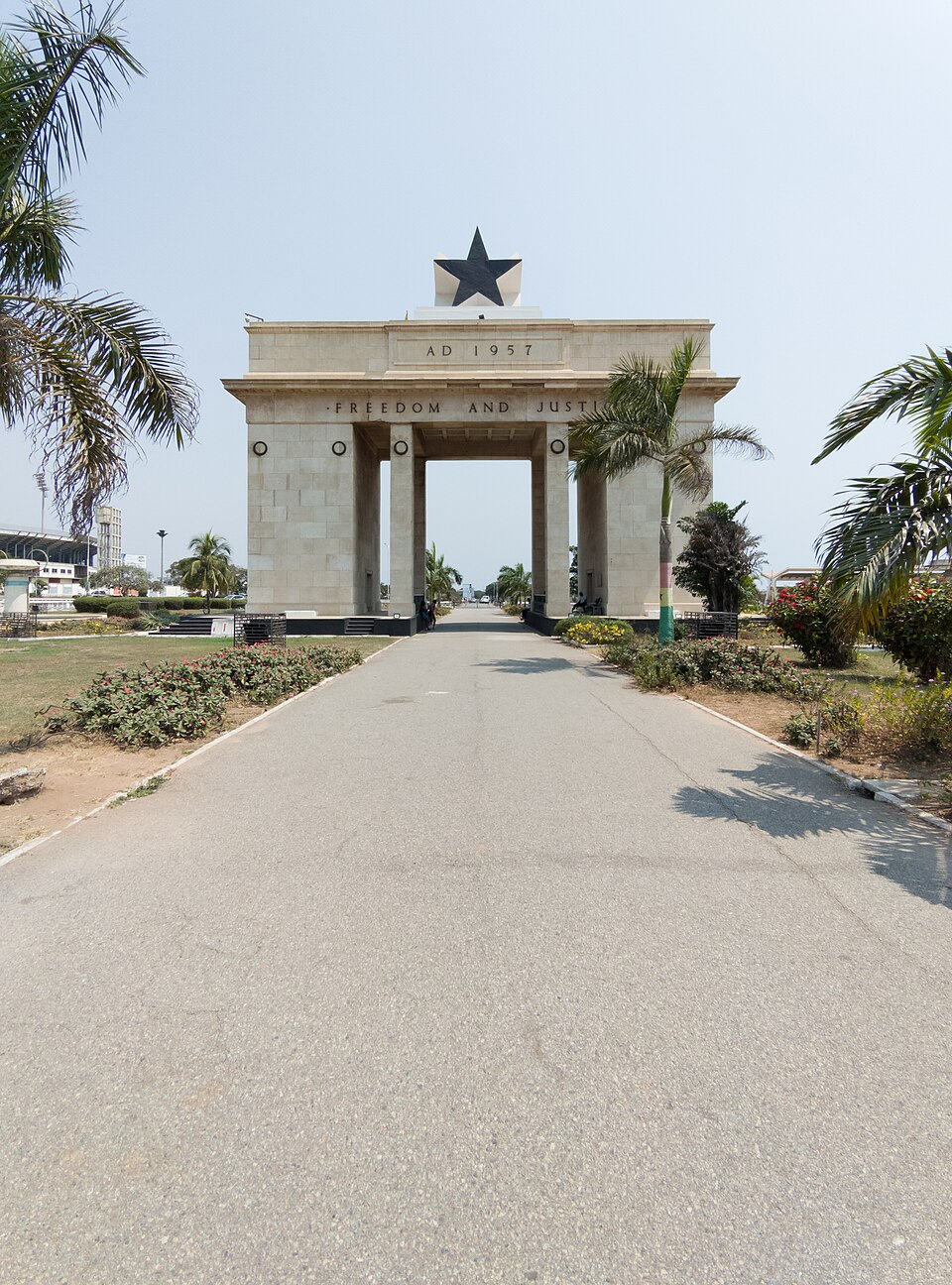 Black Star Gate at Independence Square in Accra, framed by palm trees